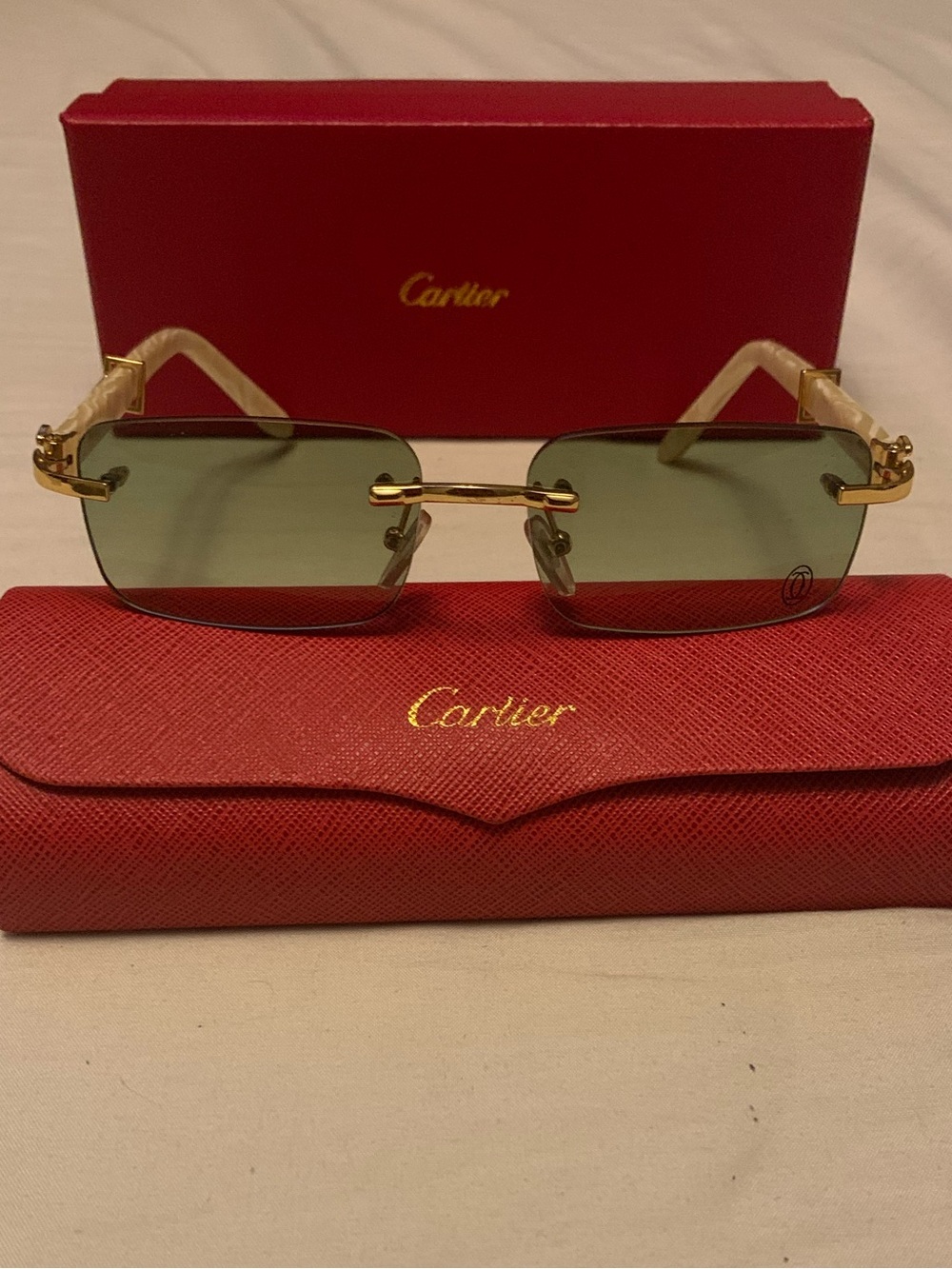 Cartier Gold Rimless Sunglasses with Green Lenses